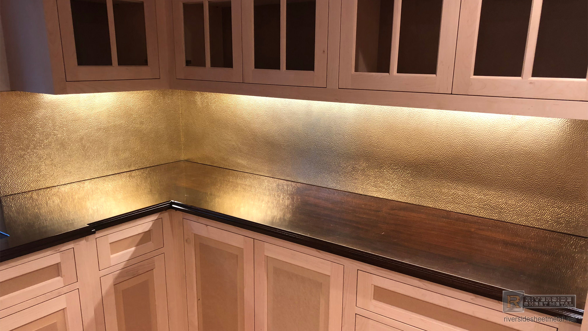 Hammered brass back splash custom fabricated and installed