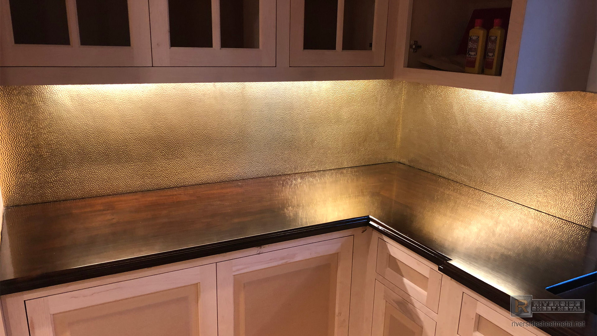 Hammered brass back splash custom fabricated and installed