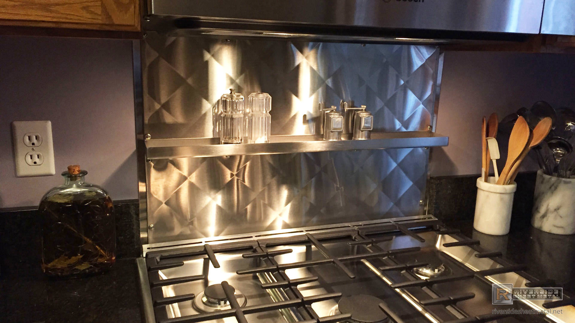 Quilted diamond stainless steel back splash installation