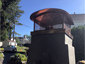Custom copper chimney cap with round roof installed over pizza oven - view 2