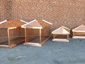 Copper chimney caps with standing seam hip roof panels - view 1