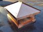 Copper chimney cap featuring standing seam hip roof panels with a flat portion - view 4