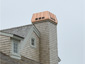 CH027 custom copper chimney shroud with standing seam panels - installation view 1