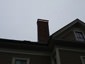 Non venting copper chimney cover for inactive chimney with angled base and flat roof - view 11