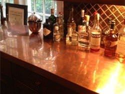 Copper counter top with liquor bottles look