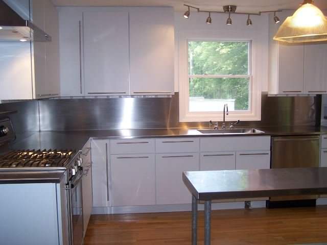 4 finish counter top with high backsplash and integrated sink