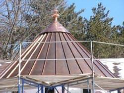 Copper roof with finial installed on