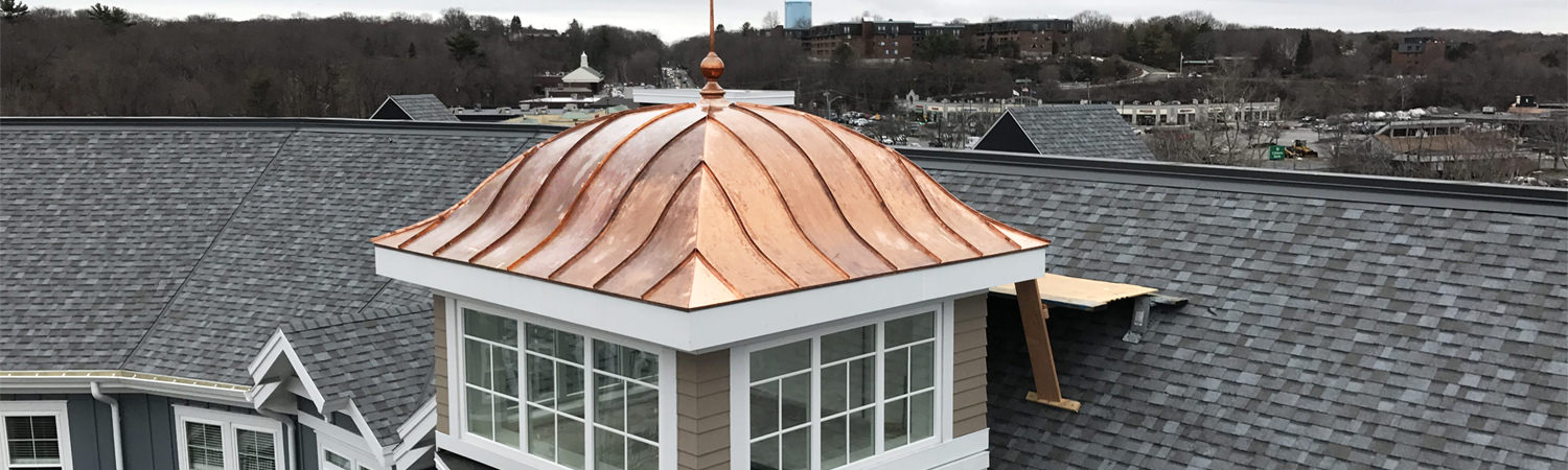 Copper cupola tower - eyebrow roof with finial