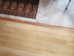 Custom copper threshold transition piece for floor