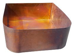 Custom copper sink over wooden cabinet