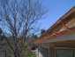 Half round copper gutter installation with undermount hangers