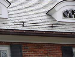 Custom copper gutter with twisted hangers