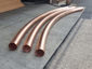 Custom plain round radius copper downspouts - view 1