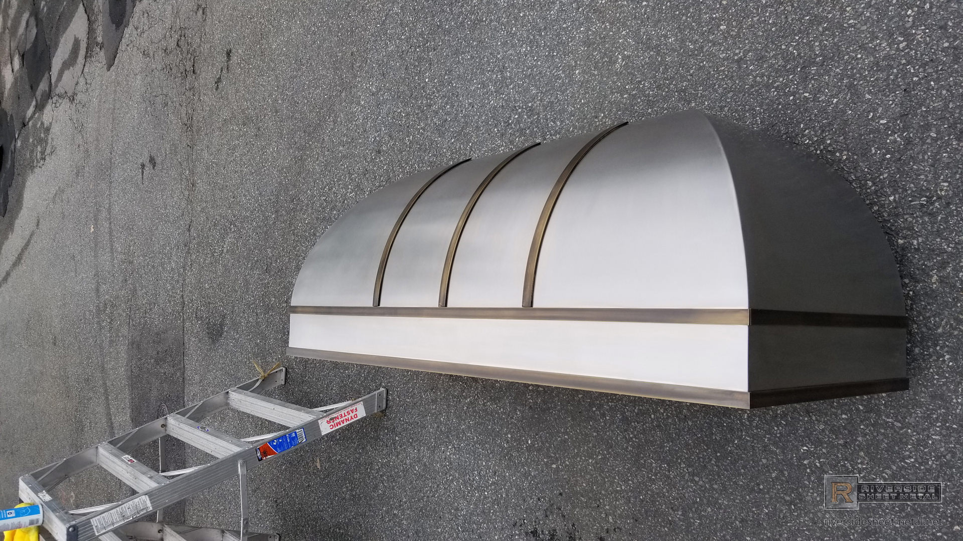Bell range hood vent with rolled stainless steel and