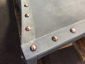 Custom fireplace hood fabricated with zinc and copper rivets - view 2