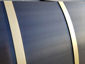 Darkened stainless steel barrel range hood with brass bandings - view 10