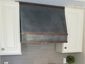 Zinc hood vent with hammered aged copper bars and dark patina finish - installation view 1