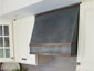 Zinc hood vent with hammered aged copper bars and dark patina finish - installation view 2