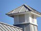 Gray aluminum cupola on metal roof