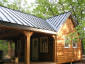 Standing seam charcoal gray steel metal roof - view 1