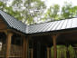 Standing seam charcoal gray steel metal roof - view 1