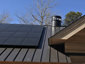 Bronze aluminum kynar standing seam roof with custom chimney cap - view 3