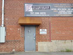 Corrugated corten rusted roof panel installation