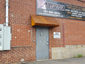 Corrugated corten rusted roof panel installation - view 2