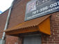 Corrugated corten rusted roof panel installation - view 3