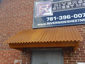 Corrugated corten rusted roof panel installation - view 4