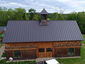 Matte black kynar aluminum metal roofing with cupola and curved panels - installation - view 1