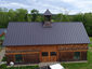 Matte black kynar aluminum metal roofing with cupola and curved panels - installation - view 1