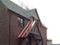 Standing seam copper panels over home entrance