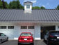 Standing seam matte black aluminum roofing with colorgard snow retention system and single bead gutter - view 2