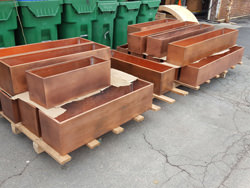 Custom copper flower boxes with dark patina finish
