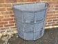 Custom darkened lead coated copper planters with grate and rivets