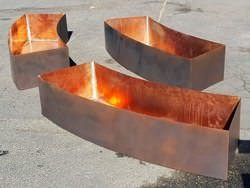 Radius copper planters darkened made to fit around a fountain