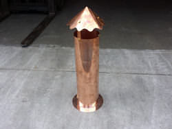 Copper round roof vent with detailed cap