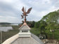 Custom copper weathervane - bald eagle catching a salmon - installation view 1