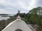 Custom copper weathervane - bald eagle catching a salmon - installation view 2