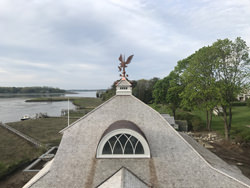 Custom copper weathervane - bald eagle catching a salmon - installation view 1